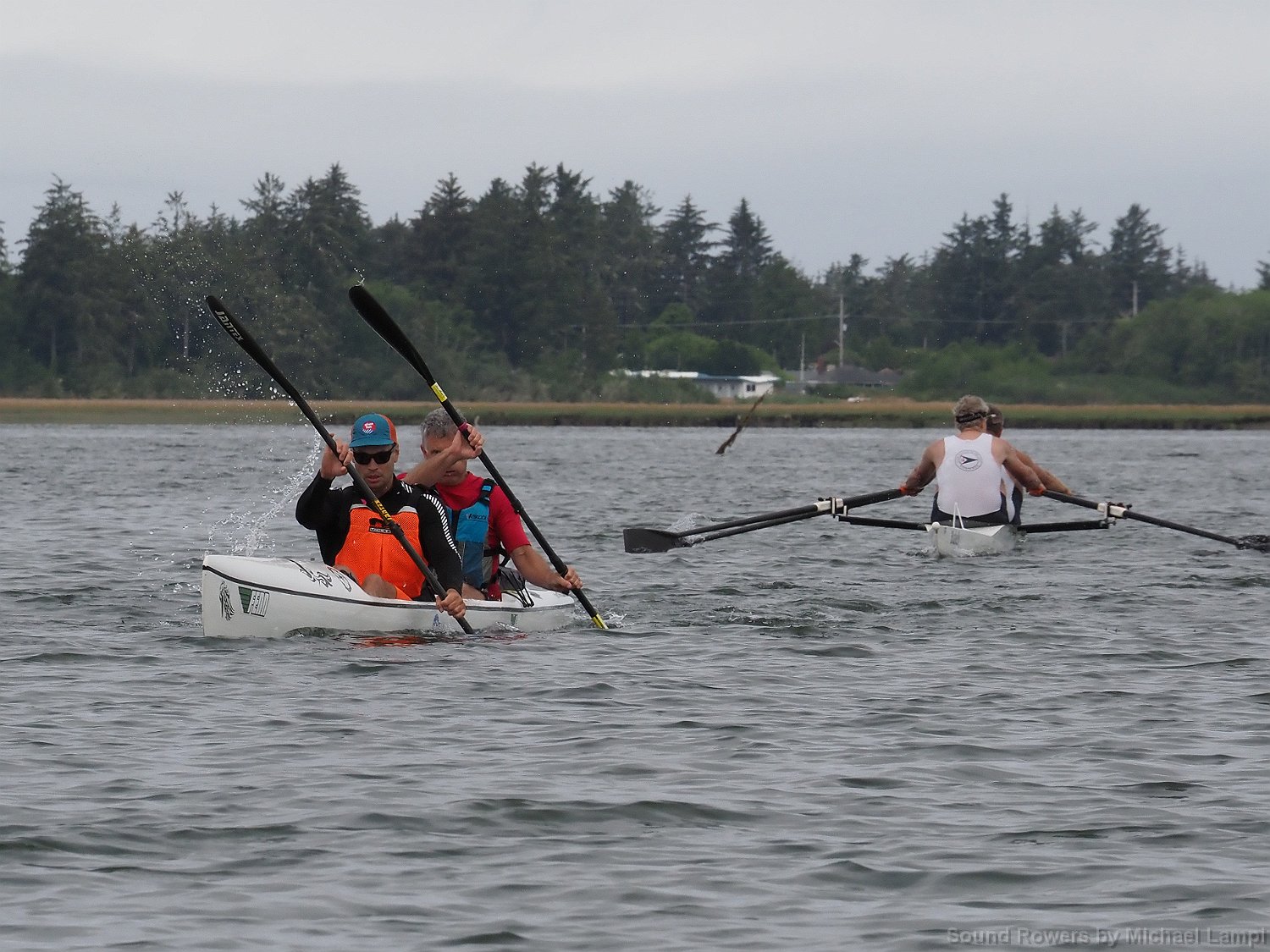 Double Scull challenging the double kayak